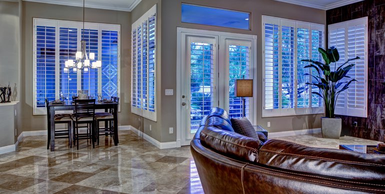 San Diego great room with plantation shutters and tile floor.